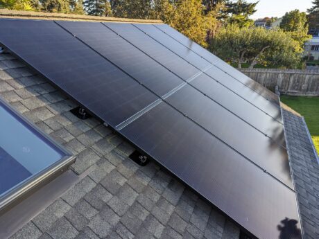 all black solar panel installation on a residential rooftop