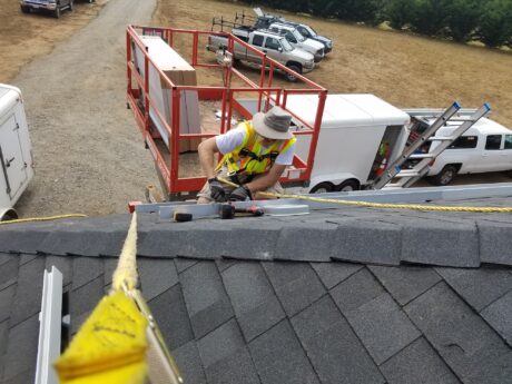 Six Rivers Solar team member installing solar panel system